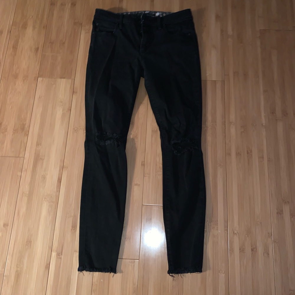 Joe’s distresses black denim jeans